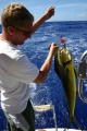 Perfecting our fishing techniques on the way to Rarotonga.