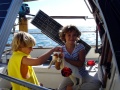 Matthew and Abbey from Sea Kardinal find a furry friend to play with.